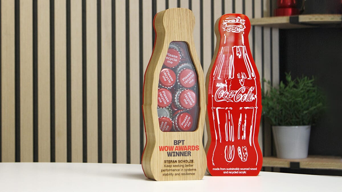 custom wooden trophy in the shape of a coke bottle