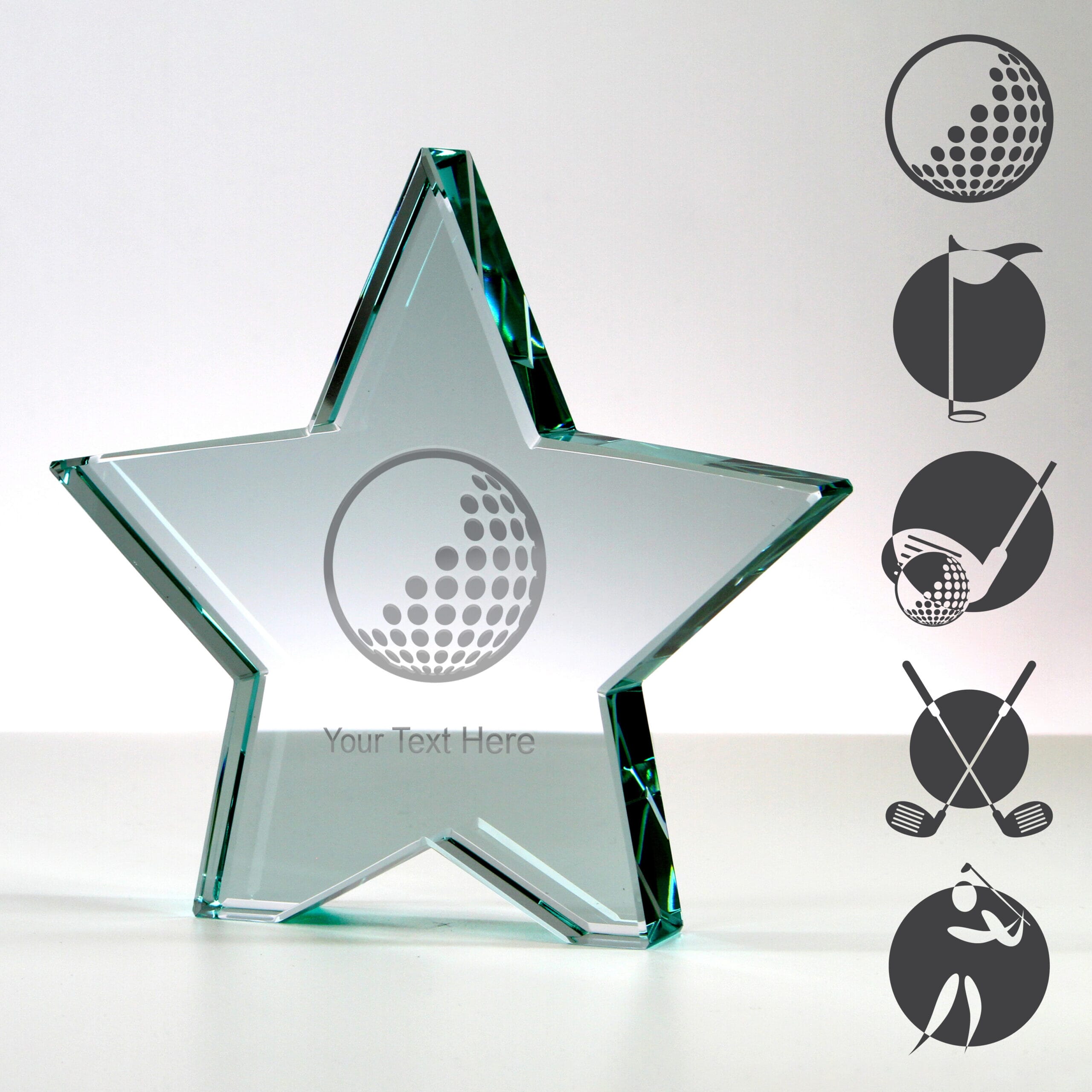 star shaped glass golf trophy with examples of golf-themed artwork engraved on the surface