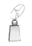 A tapered crystal golf trophy mounted with a metal figure swinging a golf club