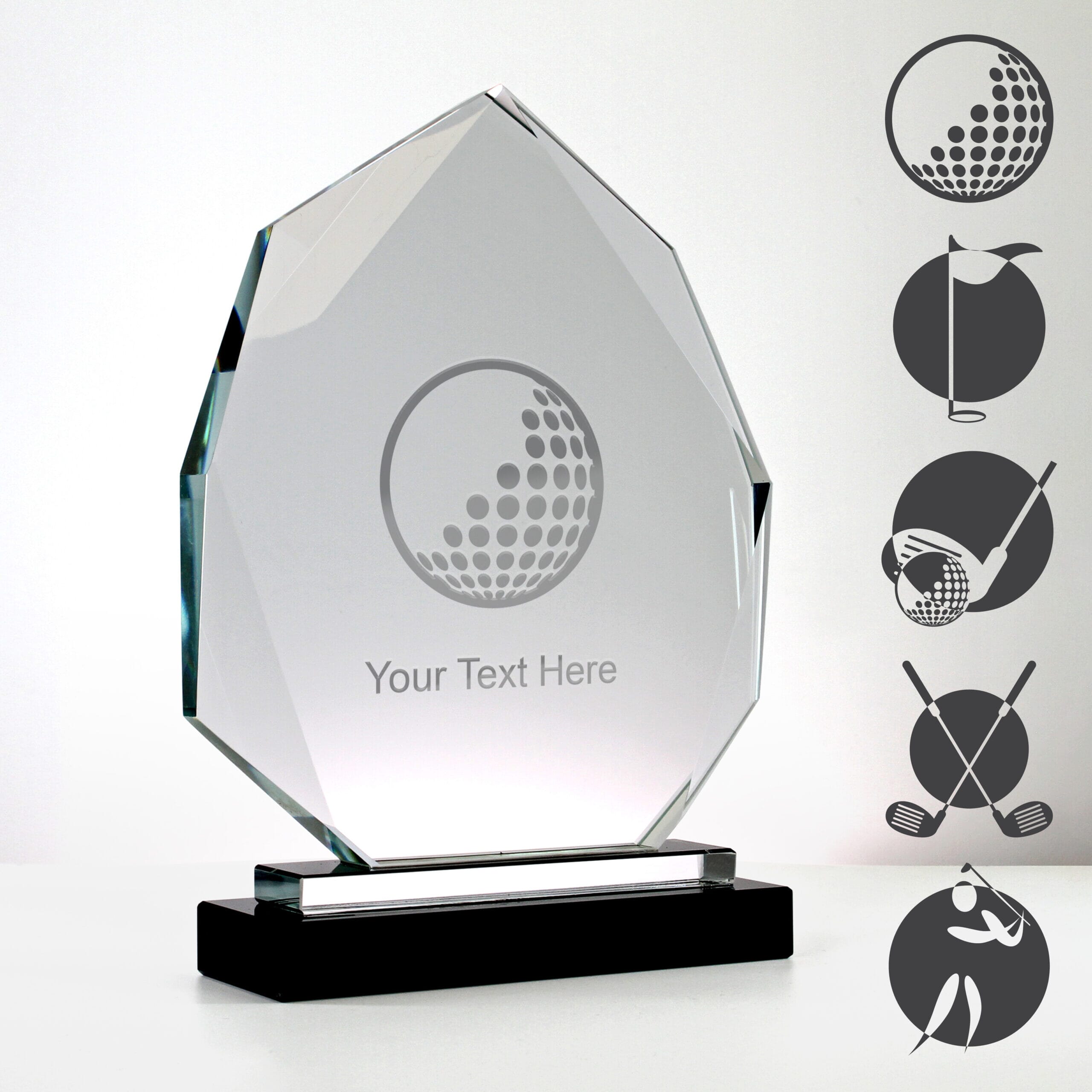 diamond crystal golf trophy mounted on a black base with examples of golf-themed artwork engraved on the surface