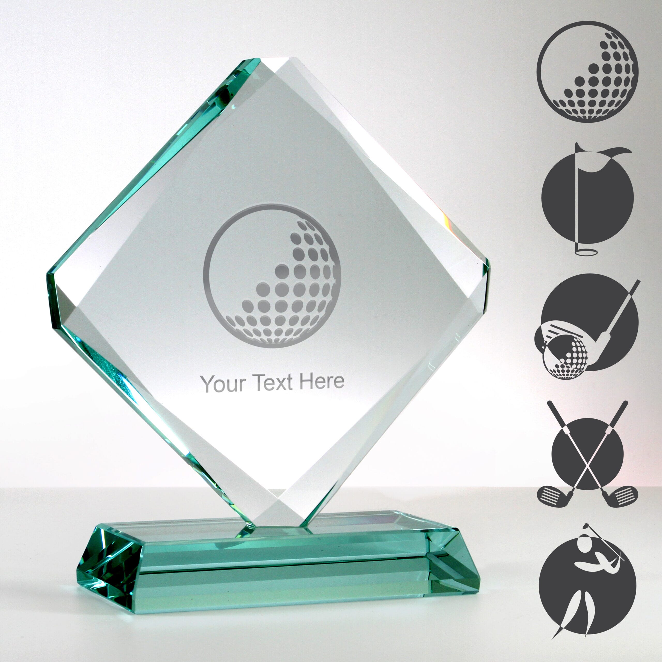 glass diamond golf trophy with examples of golf-themed artwork engraved on the surface