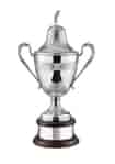 Silver-plated Riviera Golf Challenge Cup with hand chased details, mounted on a curved mahogany finish base and topped with a classic golfer figurine