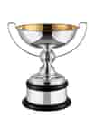 a large silver golf trophy with gold plating on the inner bowl and a hand chased golf ball on the stem