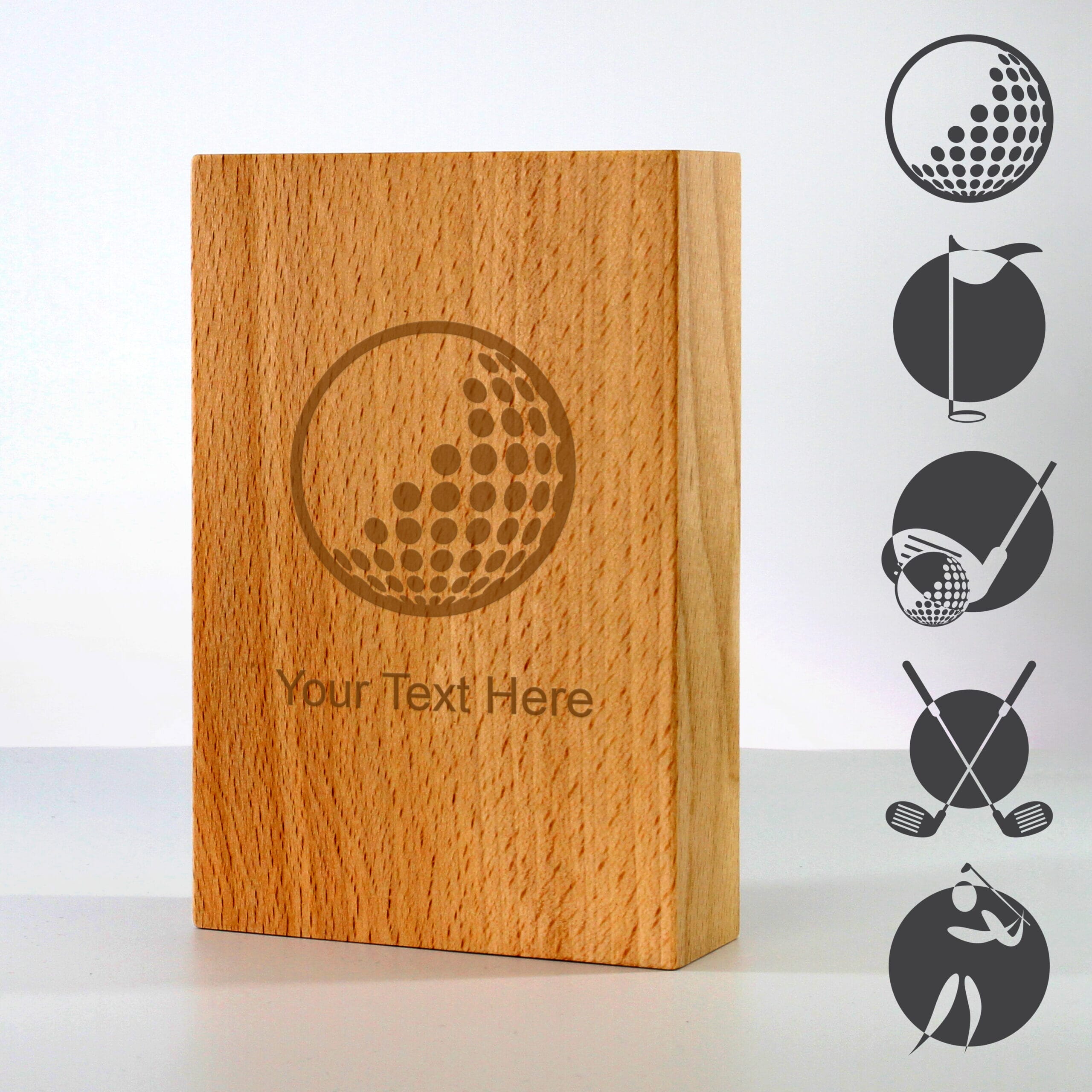 wooden golf trophy with examples of golf-themed artwork engraved on the surface