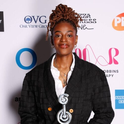 Cat-Burns-with-award-2-e1720438889514-500x500-1