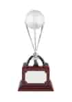 Nickel plated golf ball holder trophy with three golf clubs tapered to hold a golf ball, mounted on a square rosewood finish base with an engraving plate