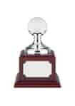 Nickel plated golf ball holder mounted on a square rosewood finish base with an engraving plate