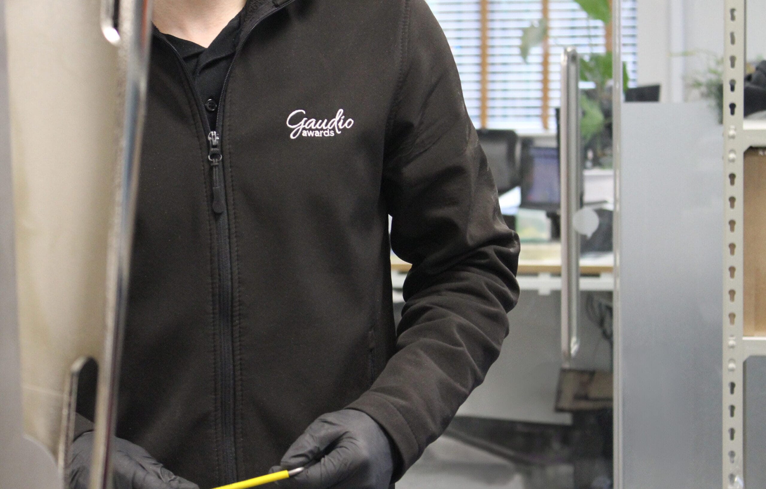 a custom trophy maker working in production