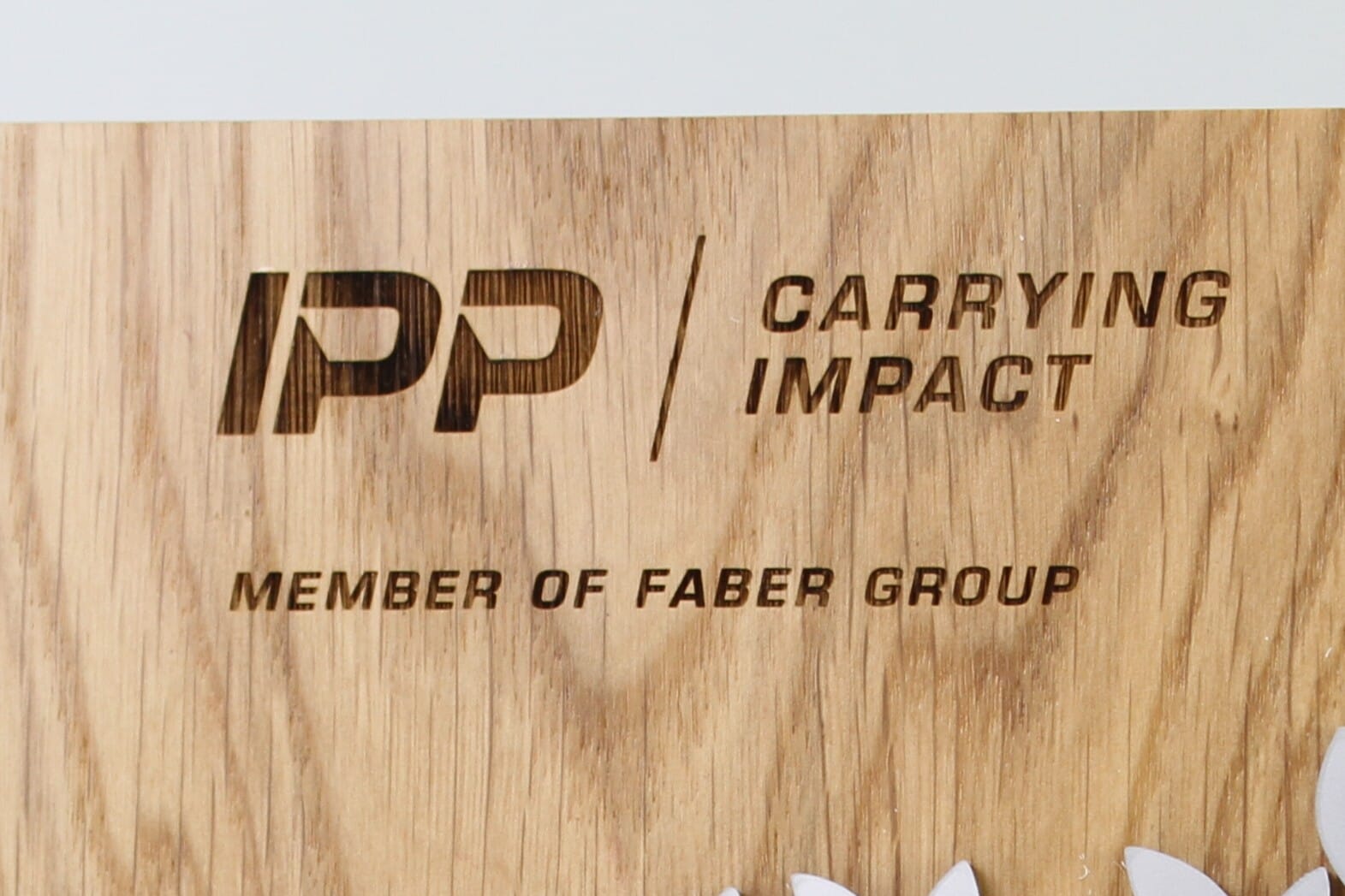engraved logo on a custom wooden trophy